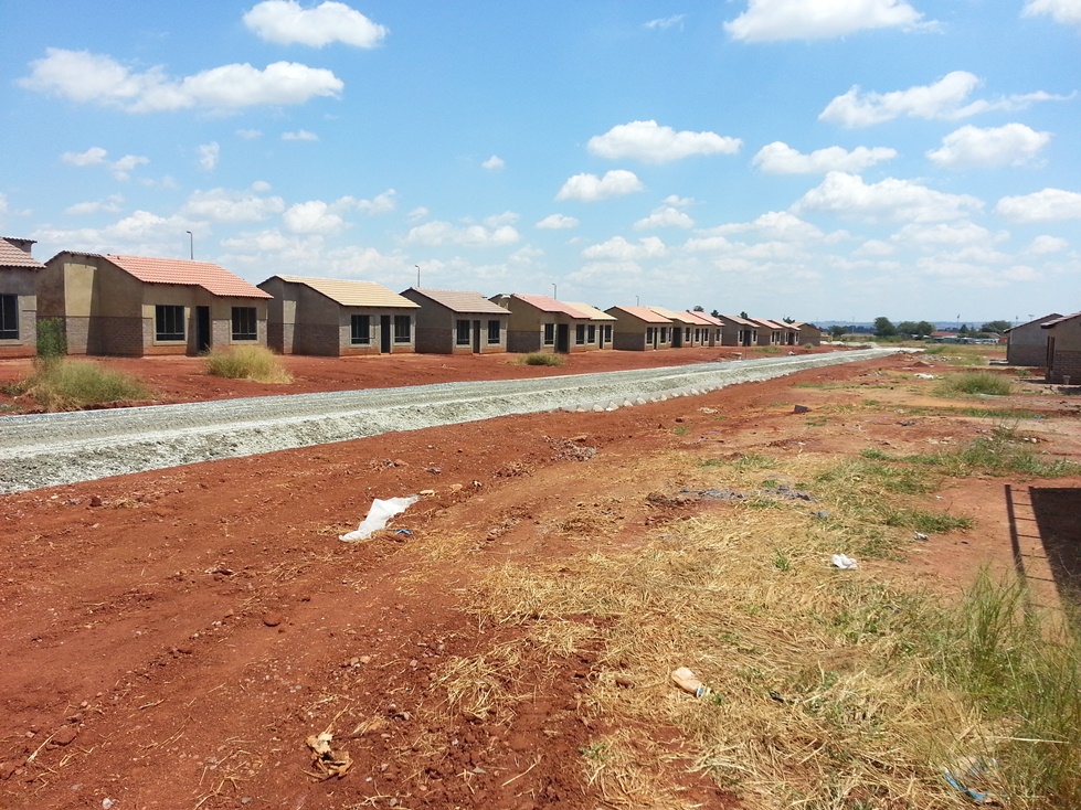 Row of newly built houses on a serviced residential development