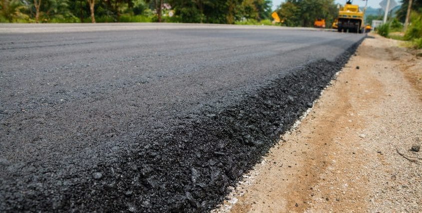 Freshly surfaced asphalt road with a finished edge